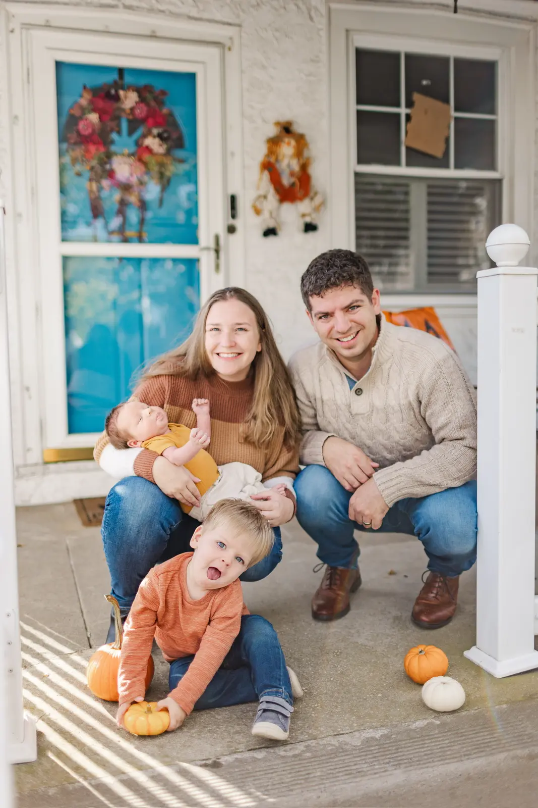 Dr. Christopher Moll with his wife and their two sons on the front porch